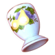 White porcelain egg cup decorated with pears / grapes.