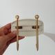 Set of 2 wall coat hooks in Bakelite and brass from the 1950s/60s.