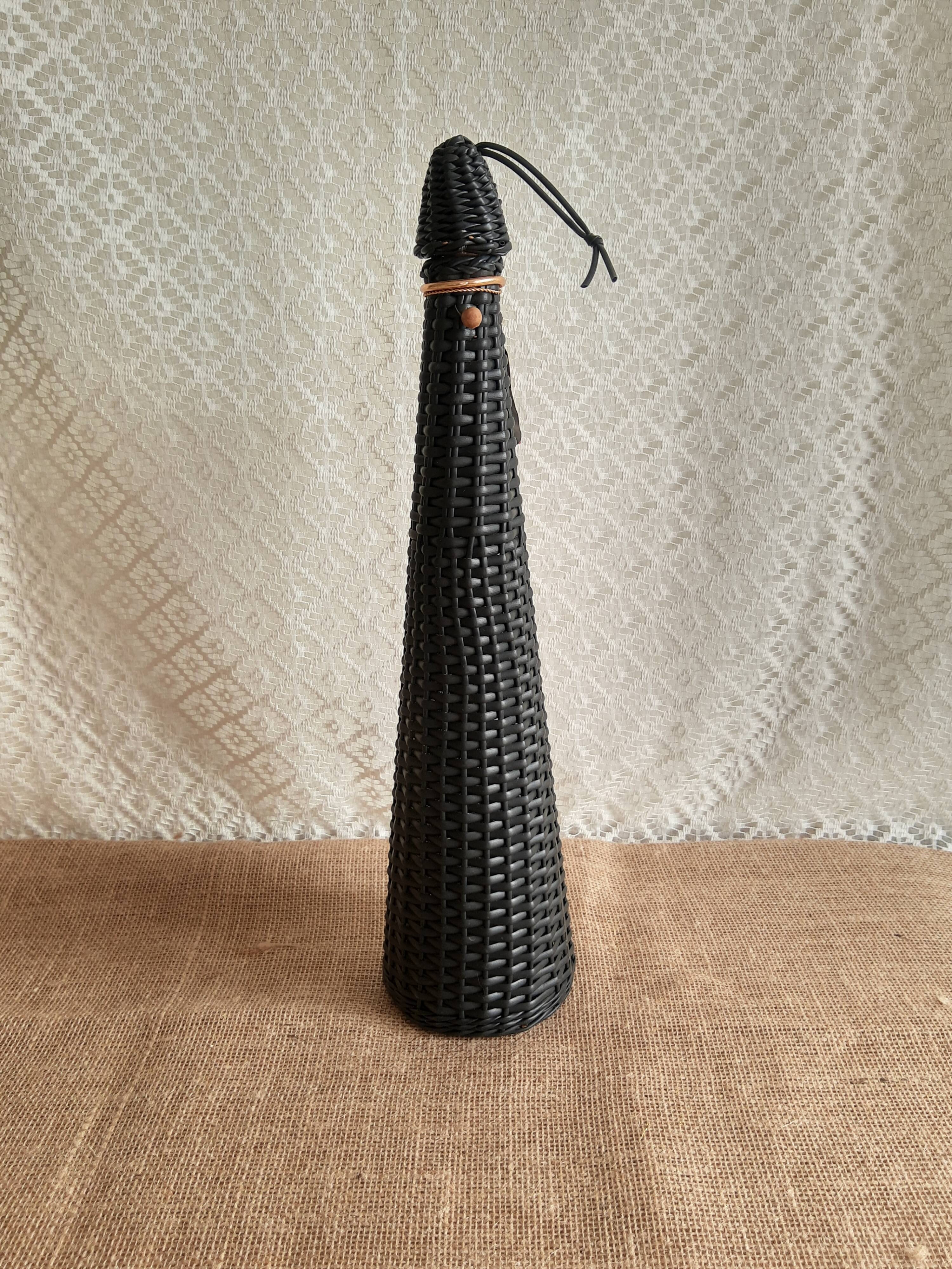 Glass bottle covered with black scoubidou with twisted golden handle - vintage