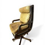 Vintage mahogany and havana leather office chair with wheels from around 1970.