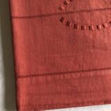 Old linen and cotton sheet in brick red