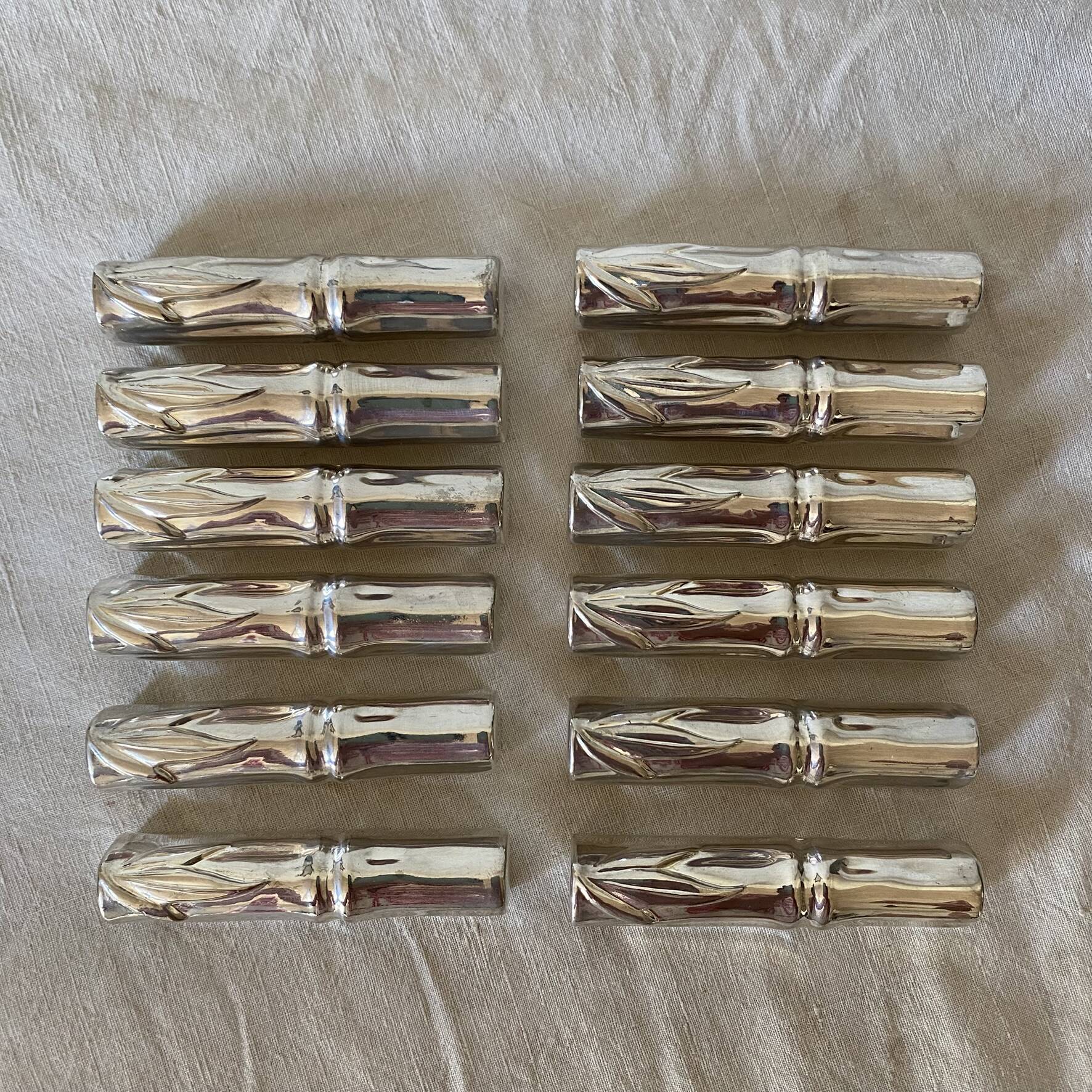 Silver bamboo knife rests from the 1980s.