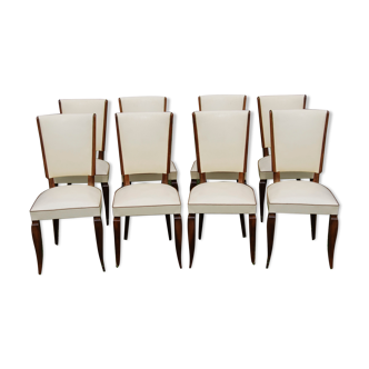Lot of 8 Vintage chairs in faux leather and spring seats from the 50s.