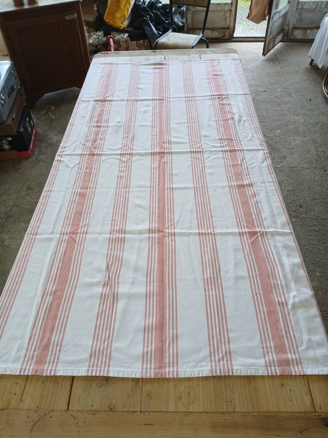 Old pink and white tablecloth