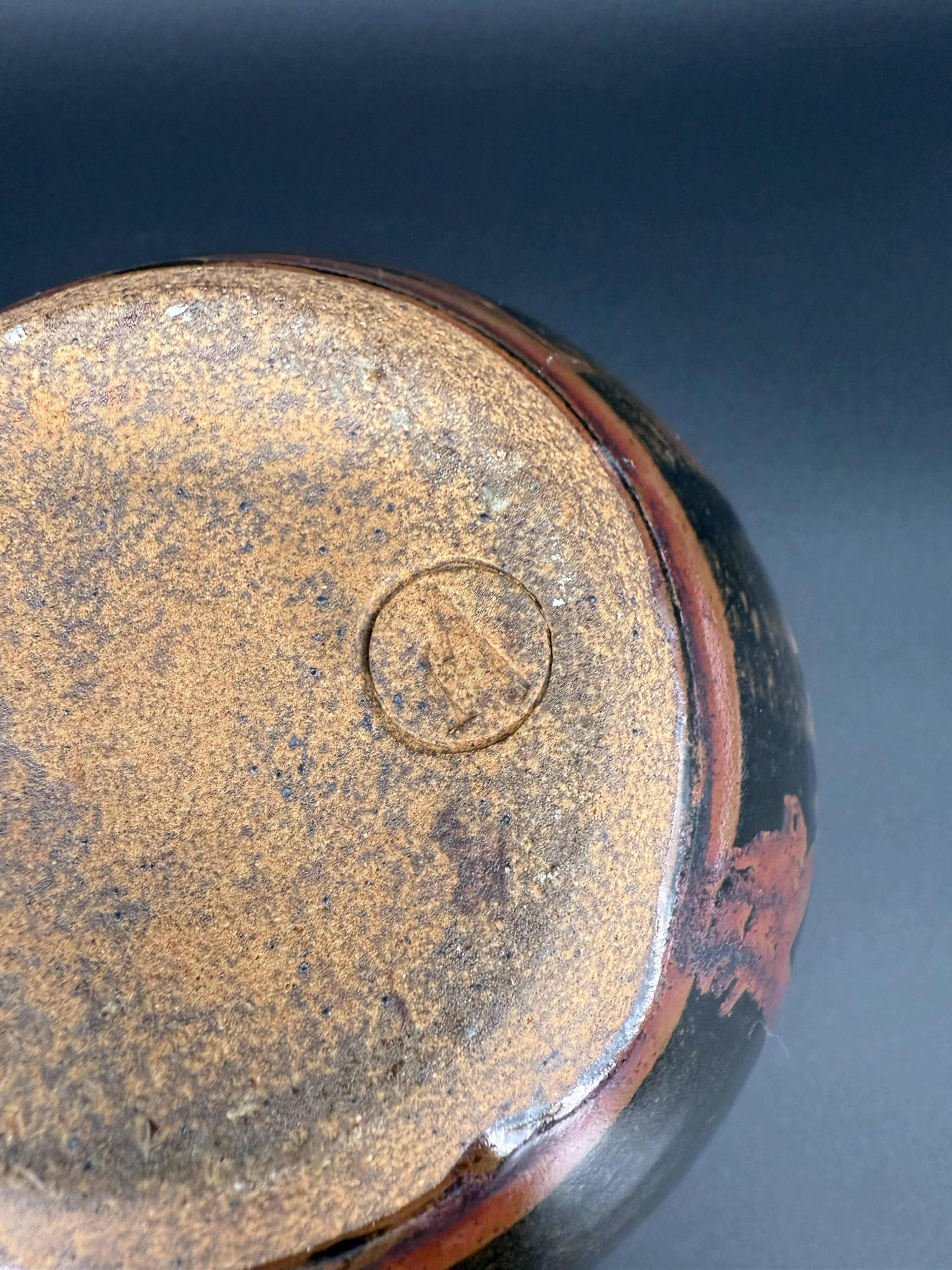 Signed black and red glazed stoneware pitcher, French artisanal ceramics