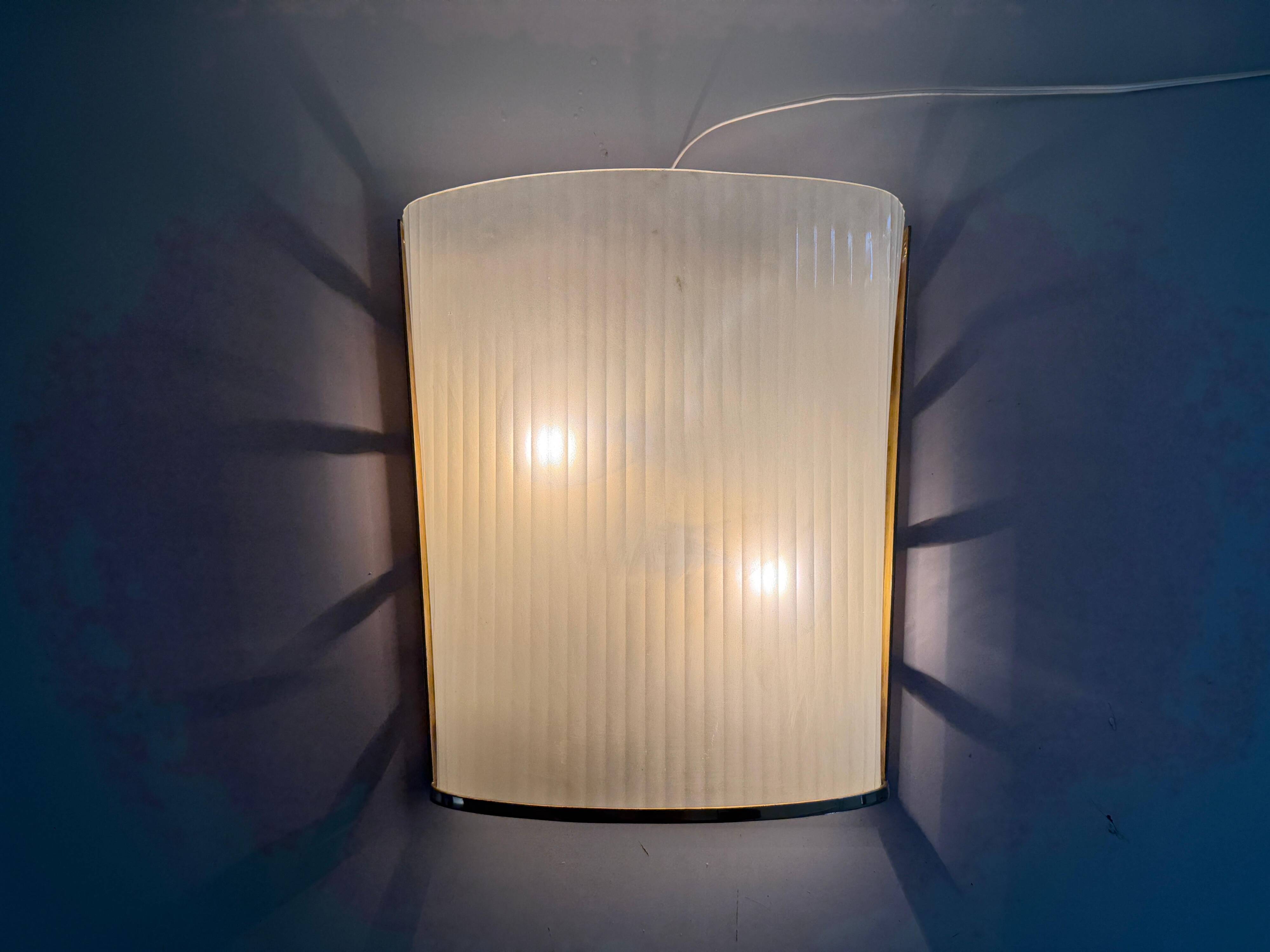 Large heavy glass wall light with a brass frame from the mid-century, 1950s, Italy.
