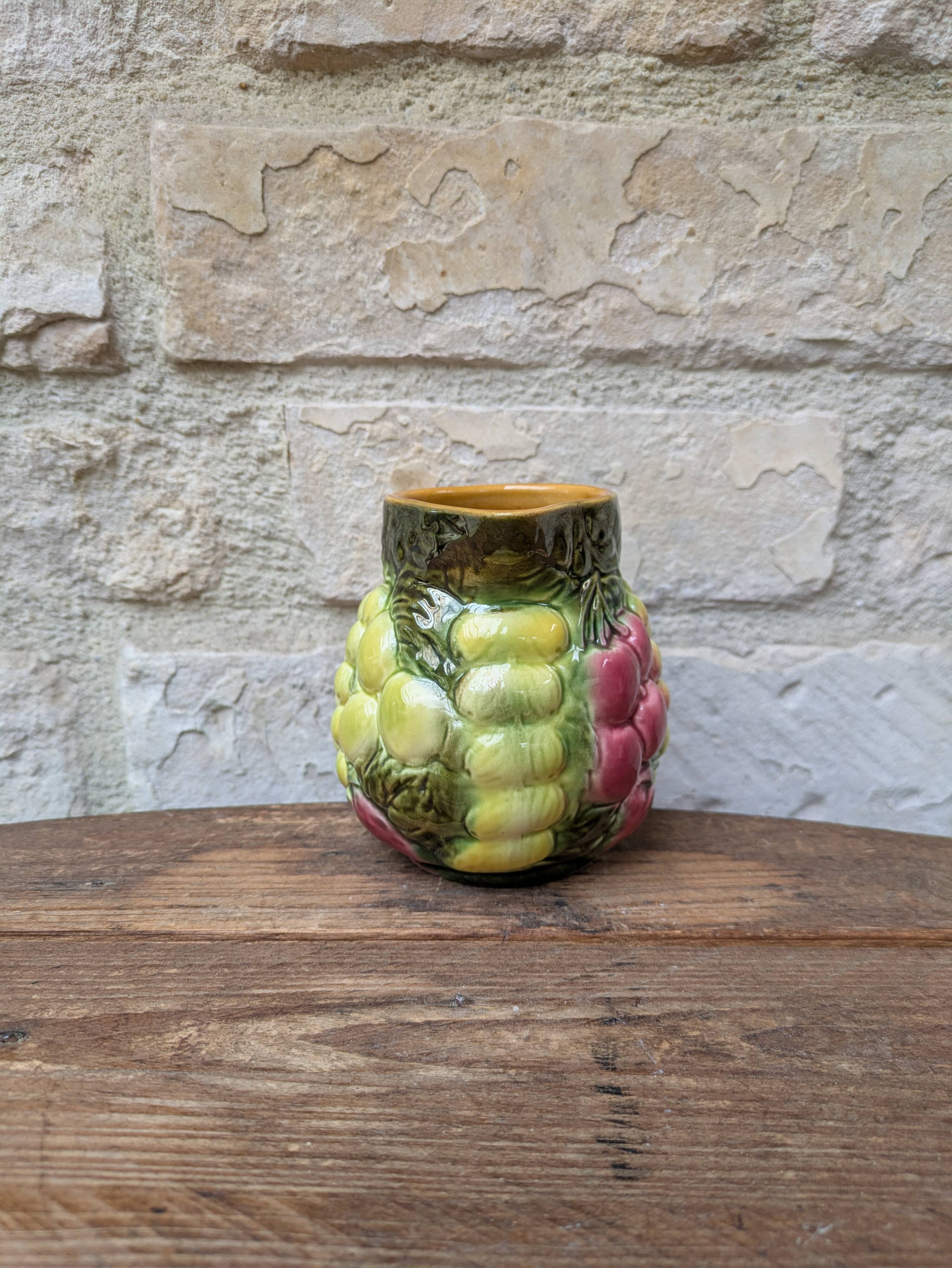 Small jug, milk pot in slipware with relief fruits Salins les Bains