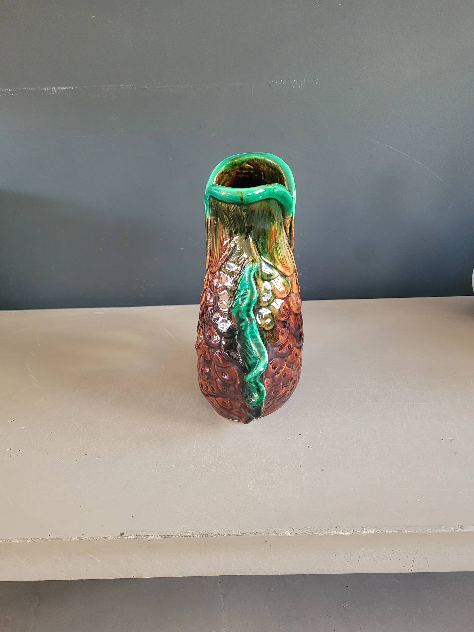 Old ceramic fish jug