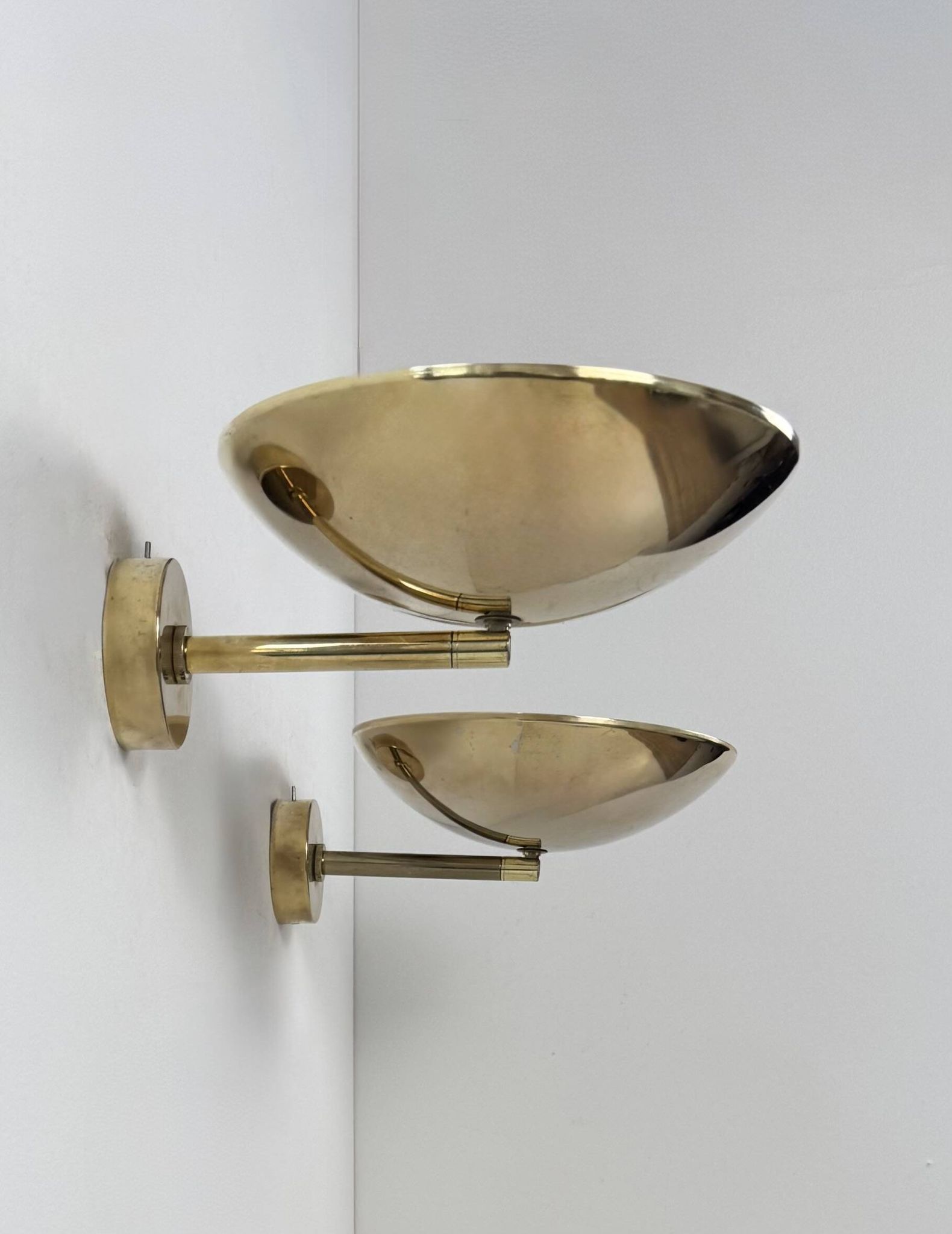 Pair of adjustable vintage wall lights, patinated brass, France, 1970.