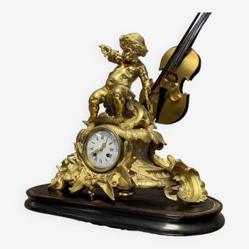 Clock with a cherub musician in gilded bronze circa 1850