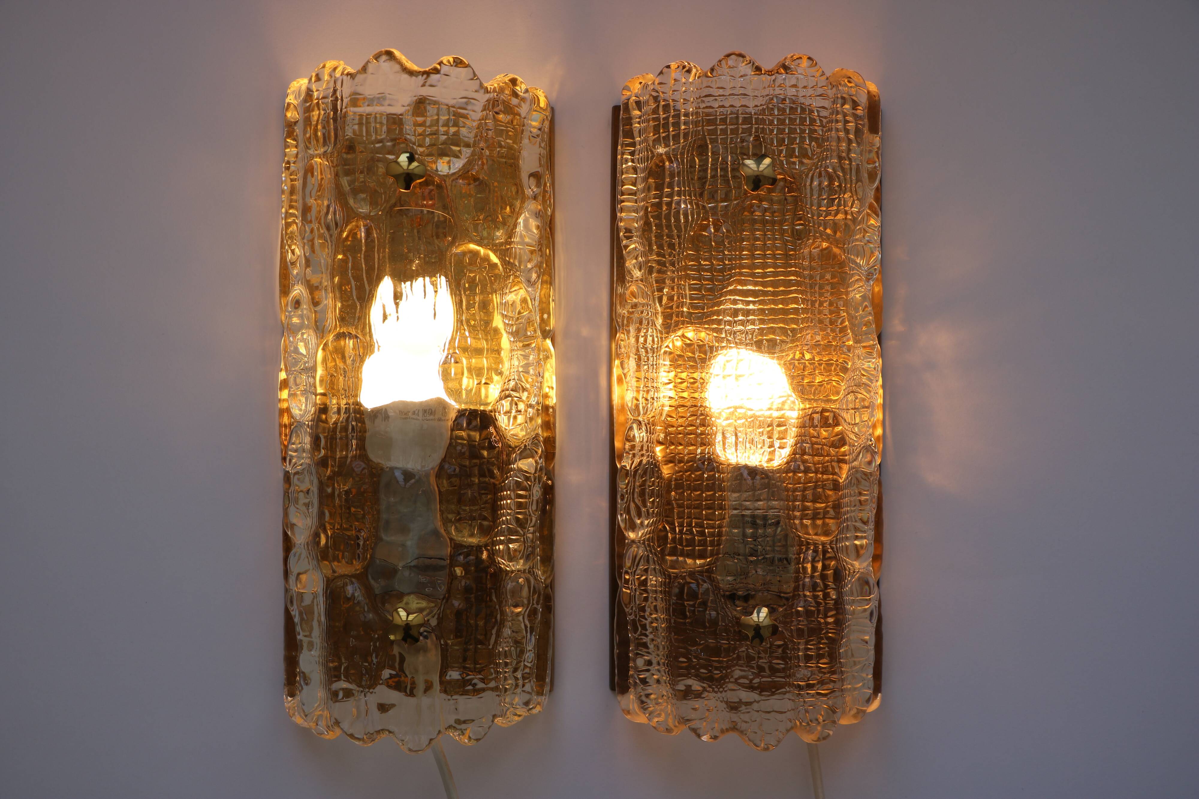 Pair of glass and brass wall lights by Carl Fagerlund for Orrefors, 1960.