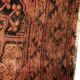 Antique Afghan/Turkmen wool rug, gul patterns, red and brown tones.
