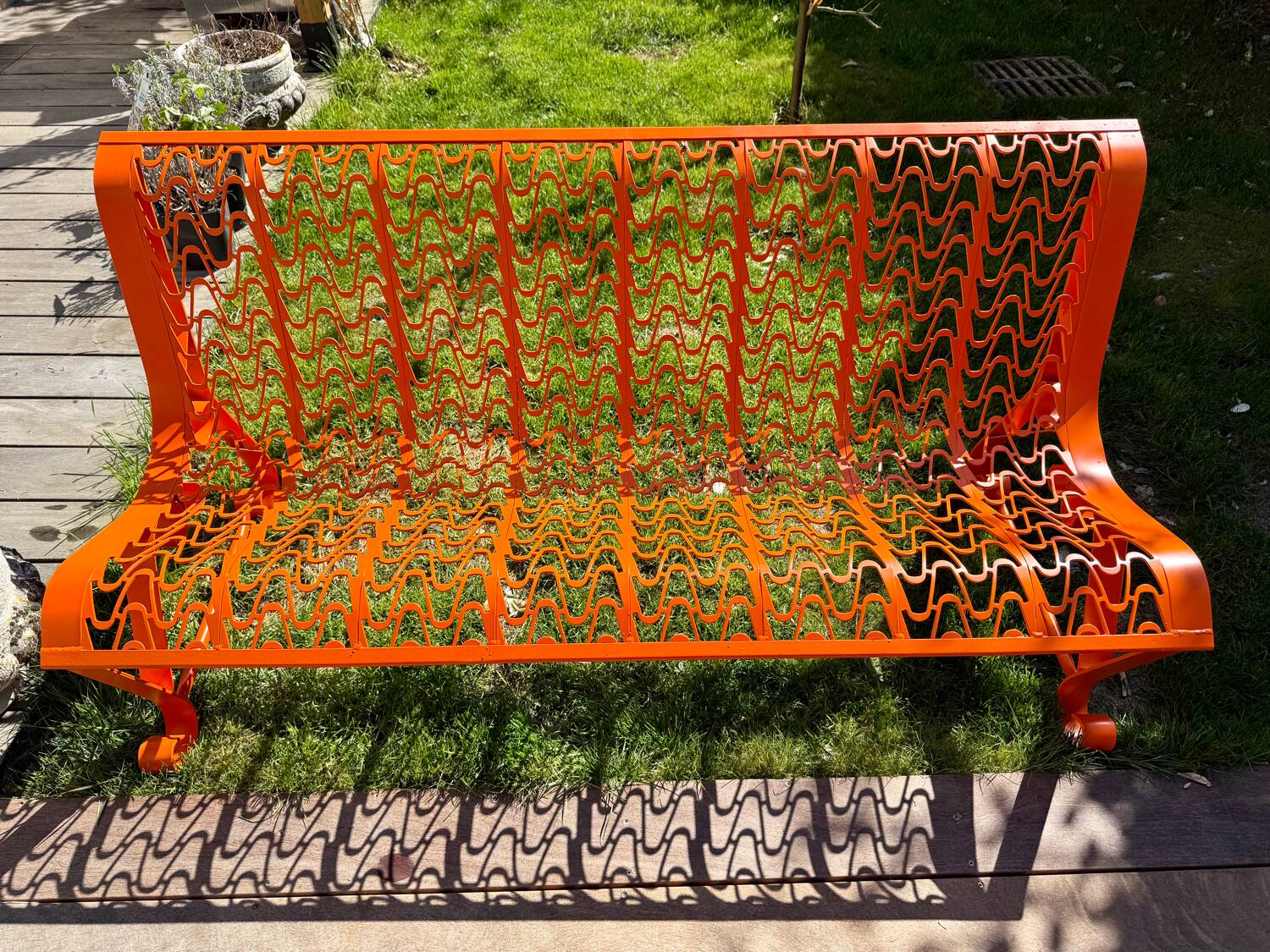 Orange pierced sheet metal bench