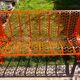 Orange pierced sheet metal bench