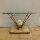 Travertine console from Fournier Paris over glass