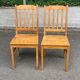 2 solid wood dining chairs