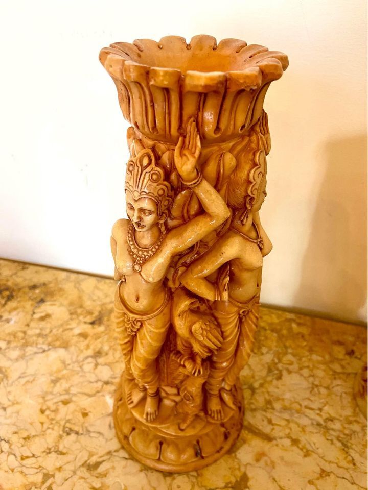 Two ancient Indonesian candlesticks.