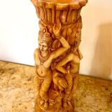 Two ancient Indonesian candlesticks.