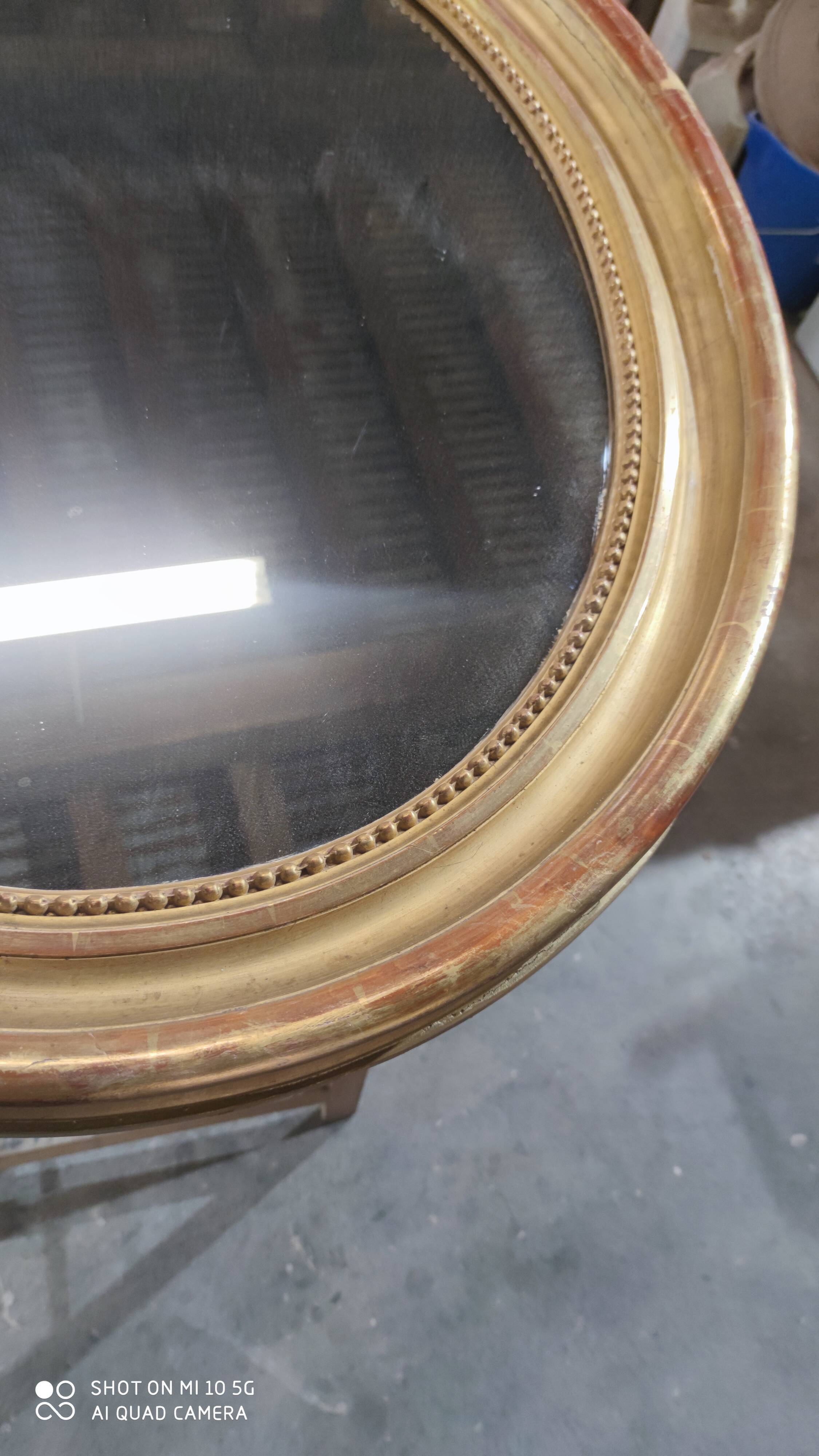 Mirror with a gilt medallion pediment, 1840