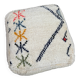 Berber floor pouf: Handwoven Moroccan wool cushion.