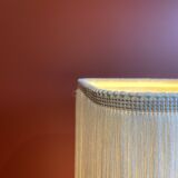 Beige marble stucco base, Houles white ecru fringed lampshade.