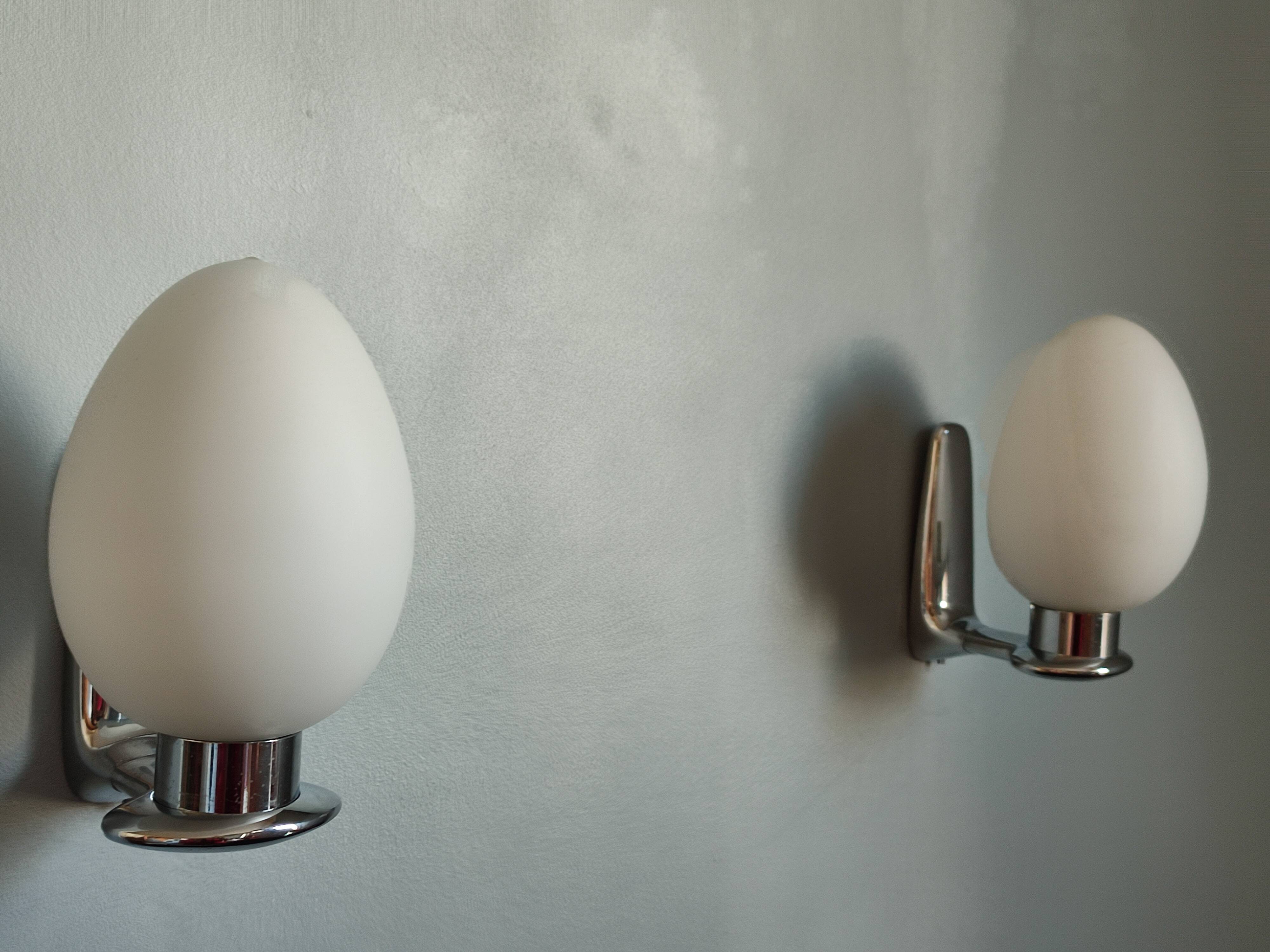 Pair of ouefs sconces in opaline and vintage chromed metal