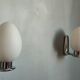 Pair of ouefs sconces in opaline and vintage chromed metal