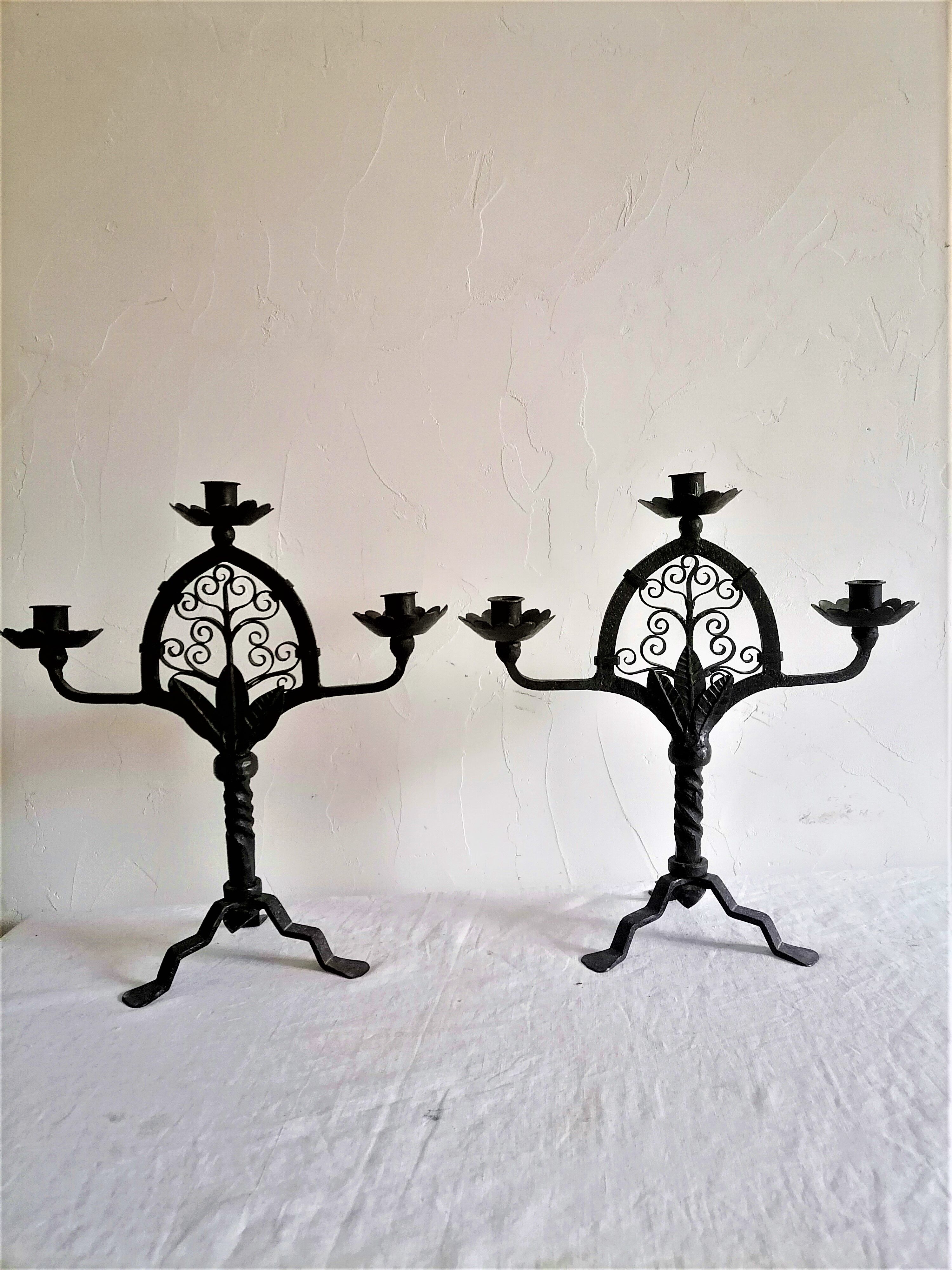 Pair of wrought iron candelabras. Mid-twentieth century.