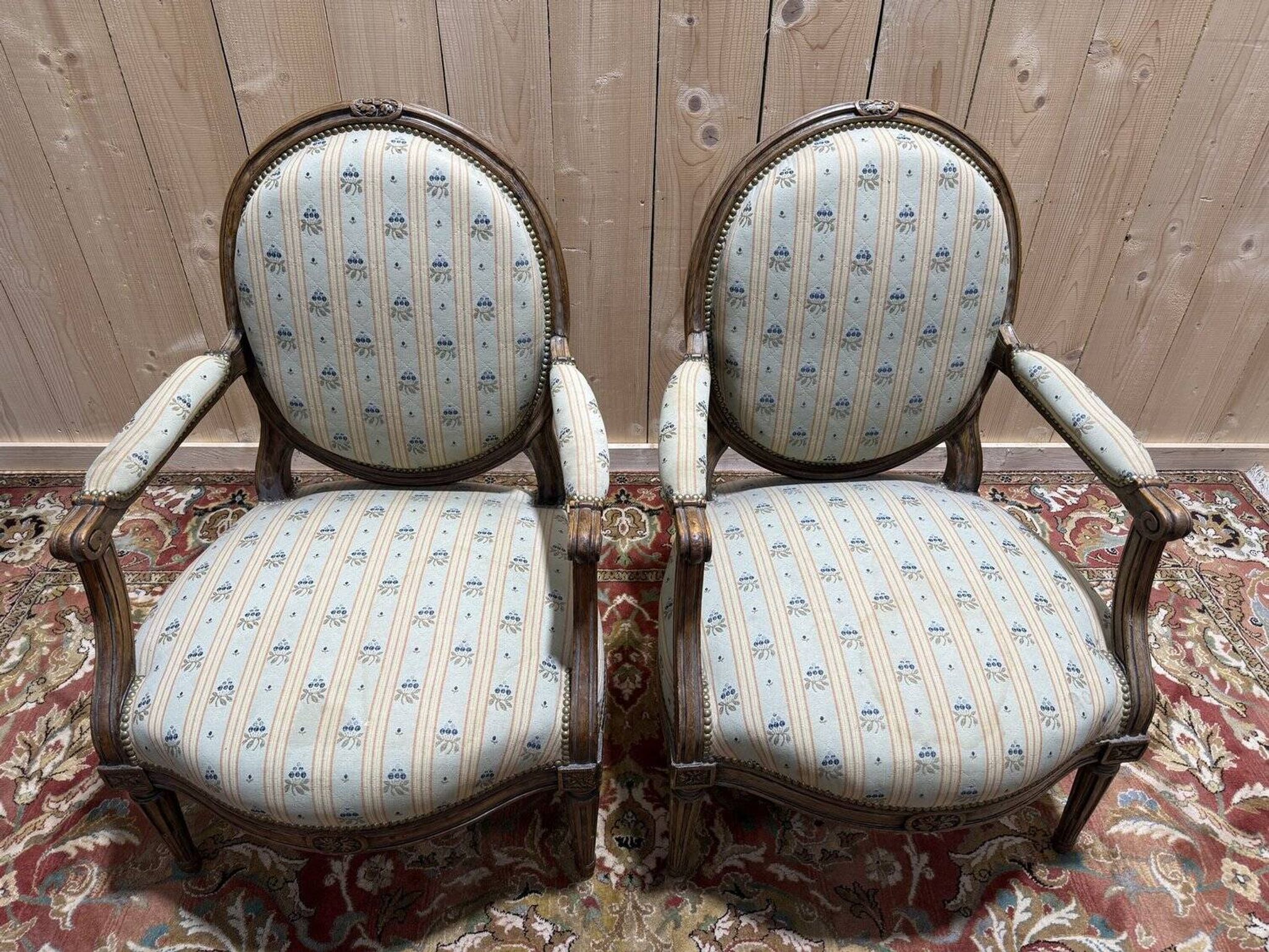 Pair of cabriole armchairs with medallion backs from the Louis XVI period, stamped OT.