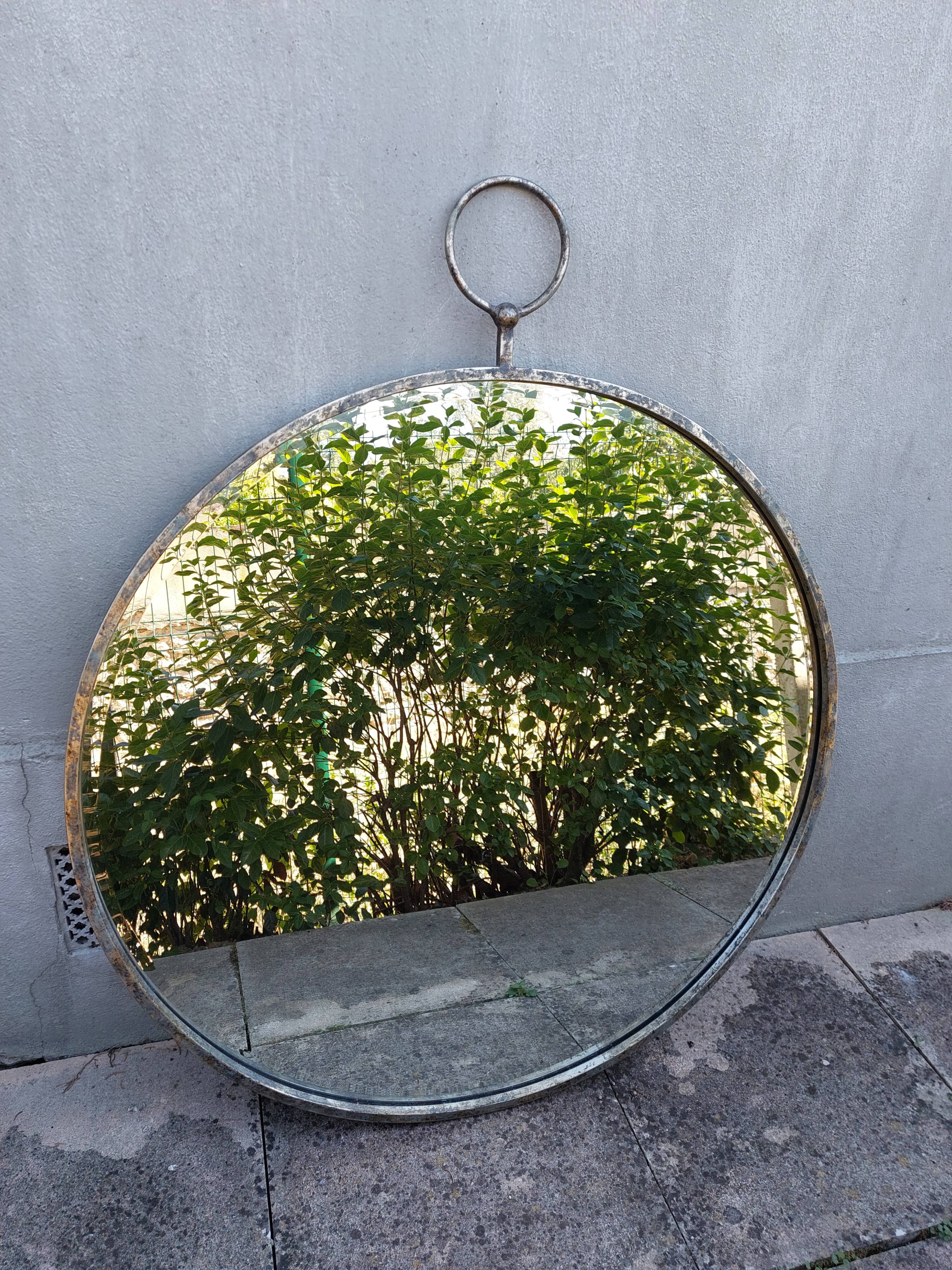 Round patinated mirror