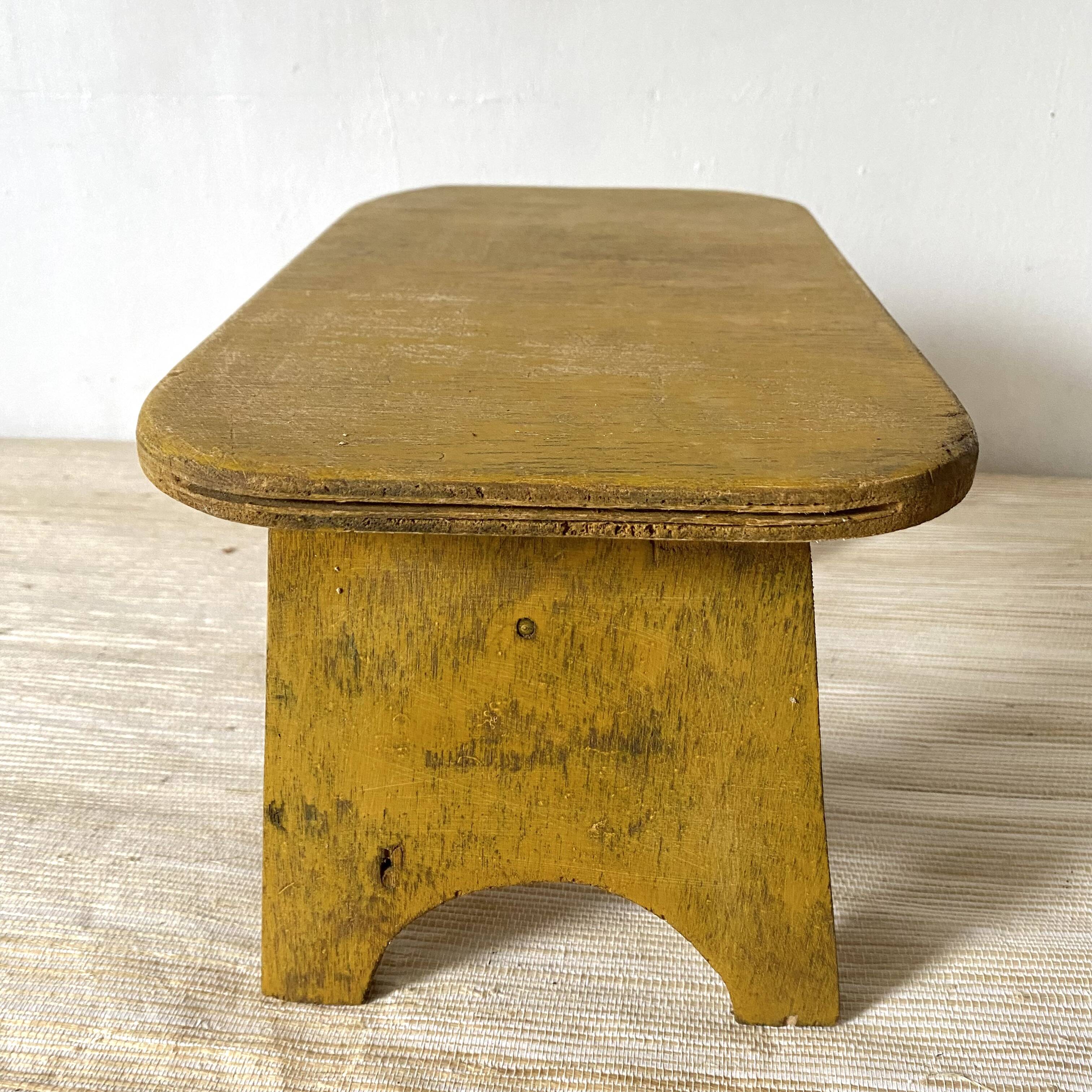 Low stool, plant stand in yellow painted wood