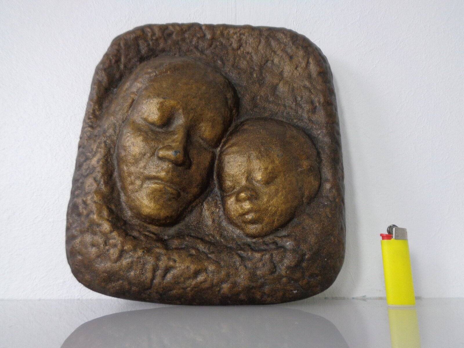 German bronze relief of mother with baby, 1940s.