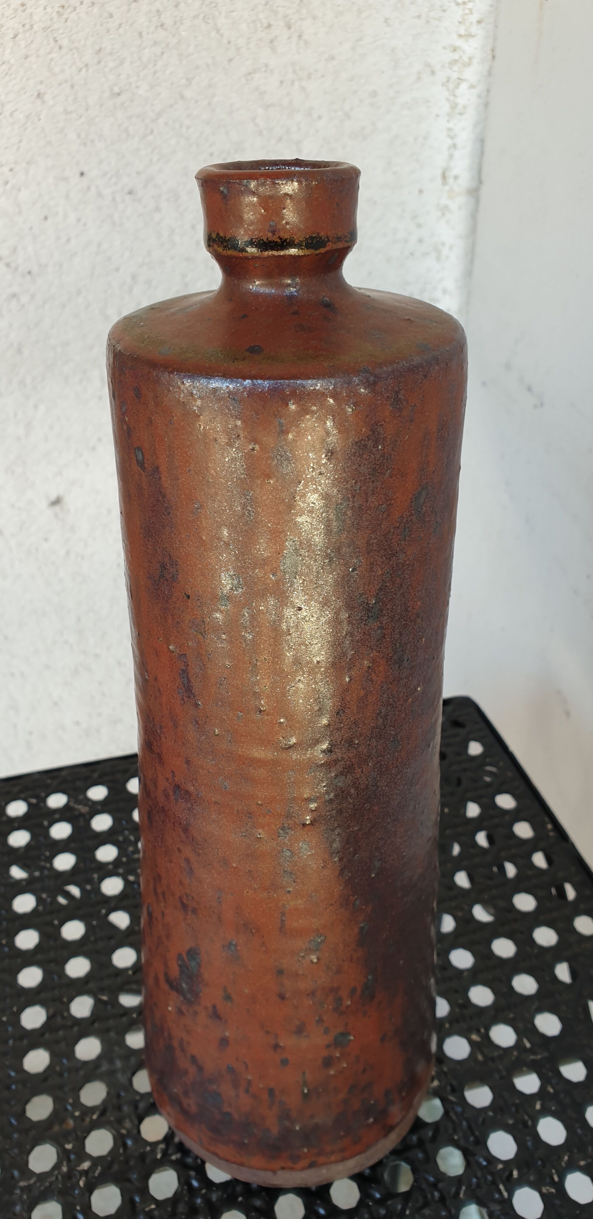 Old bottle in pyrity sandstone