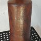 Old bottle in pyrity sandstone