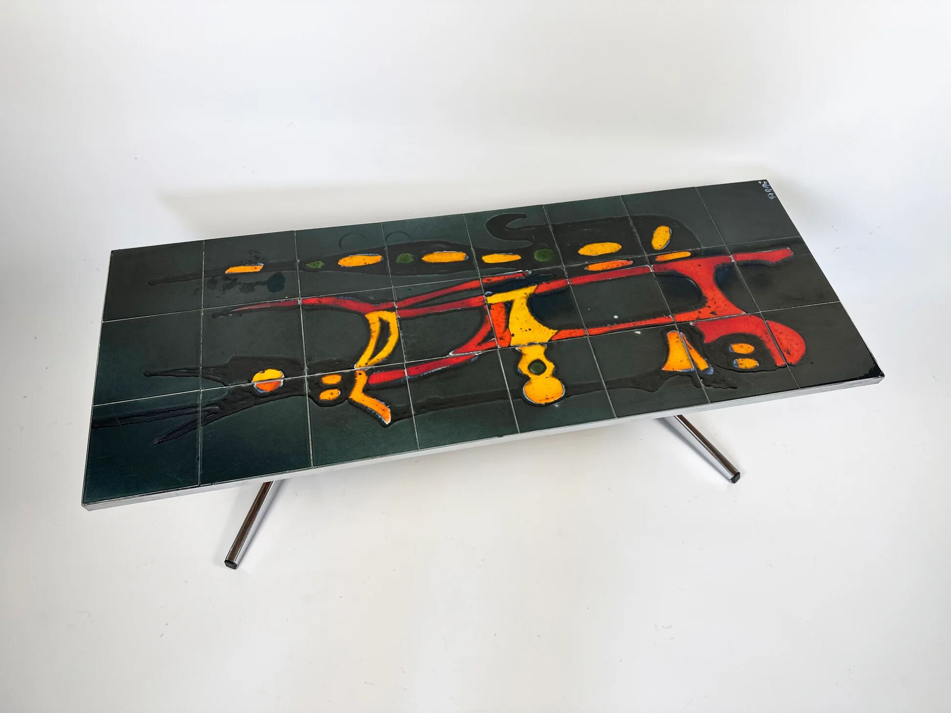Mid-century coffee table with ceramic top by Adri Belgium.
