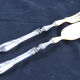 Salad serving set in antique ivory, silver-plated handle.