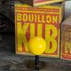 Vintage yellow wooden wall-mounted ball coat hook.