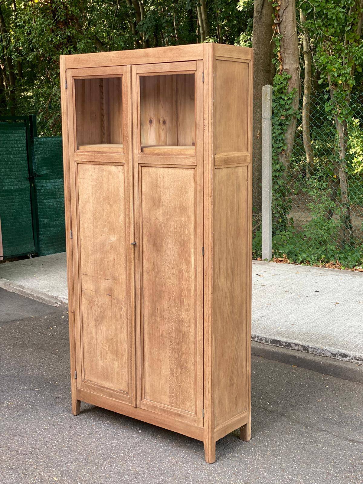 Parisian bonnetière cabinet, stripped display in solid oak from the 1930s.