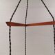 Three-part pendant in crystal glass, teak wood, and thin dusty green metal