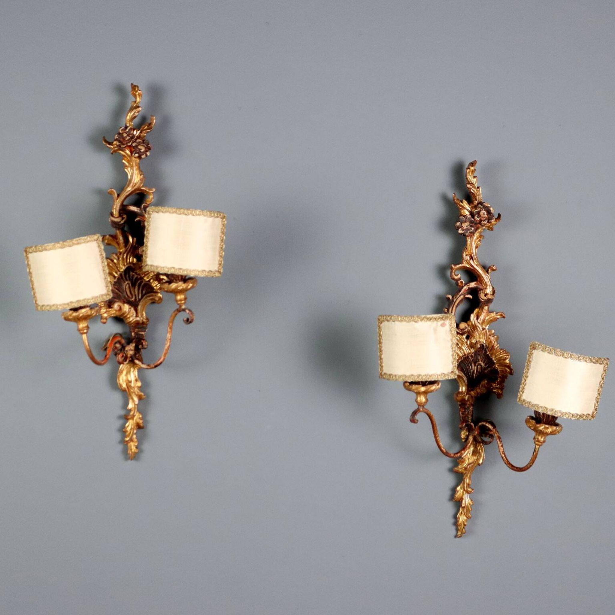 Antique wall sconces in carved lacquered and gilded wood, Italy, 20th century.