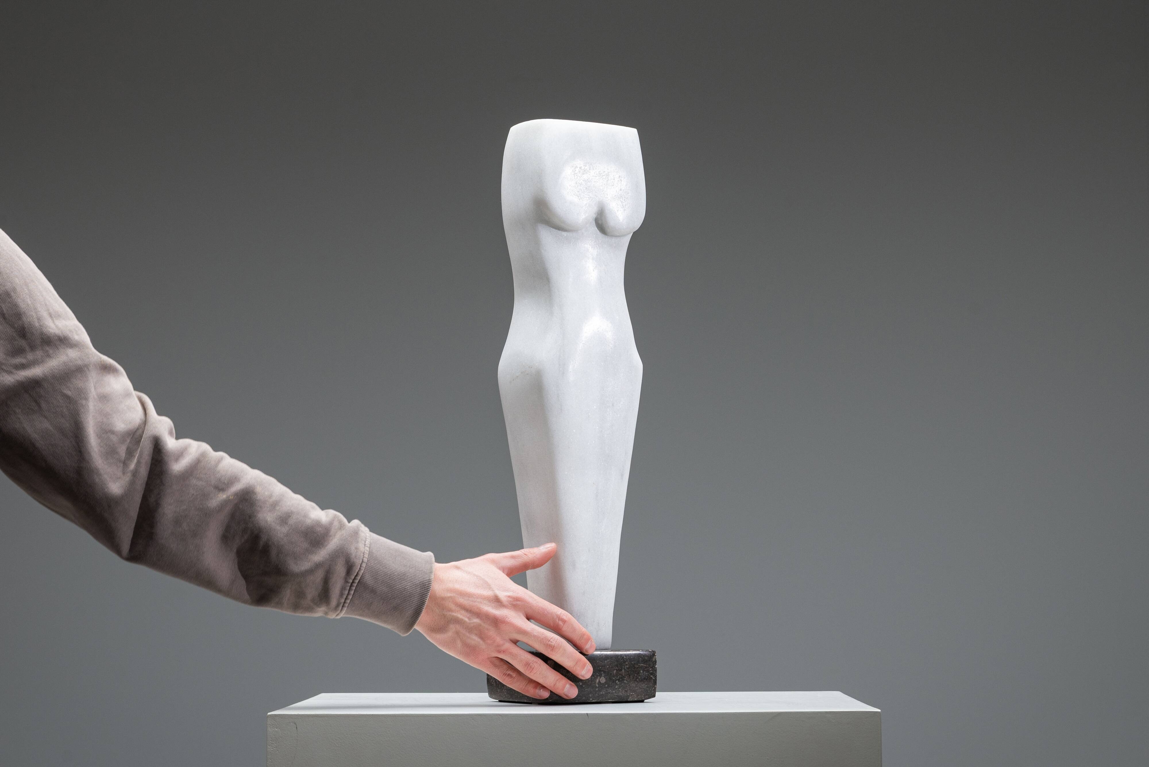 Abstract solid white marble torso