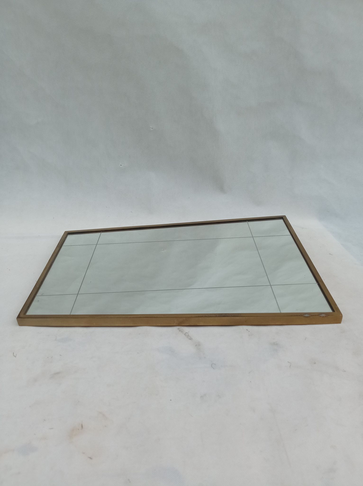 Mirror in a brass frame, dating back to the 1960s