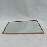 Mirror in a brass frame, dating back to the 1960s