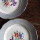 A set of 4 flat plates in pink and blue with Fontanges flowers from Sarreguemines.
