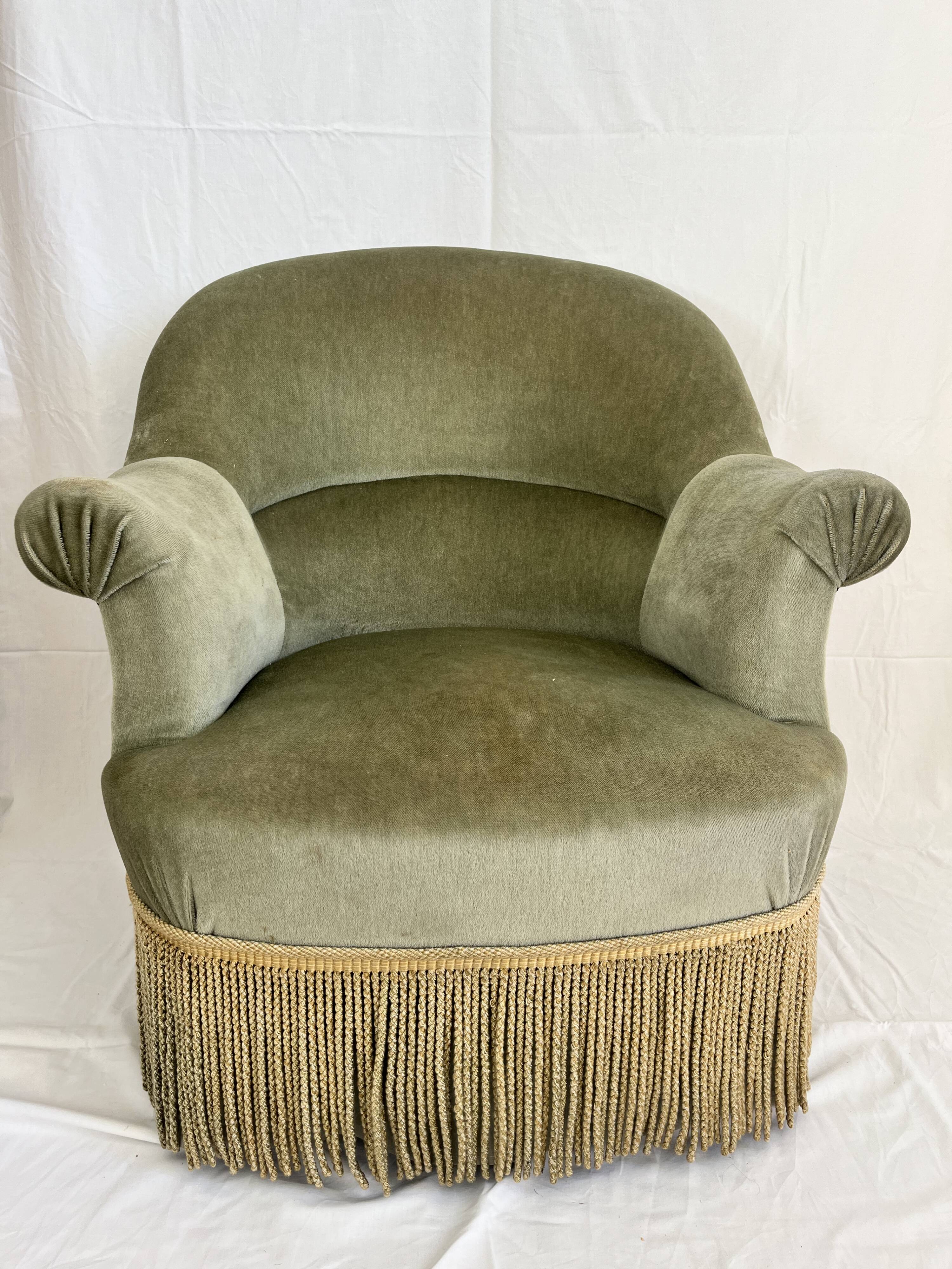 sage green toad armchairs with gold fringe