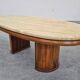 Mid-century coffee table in walnut with a travertine top.