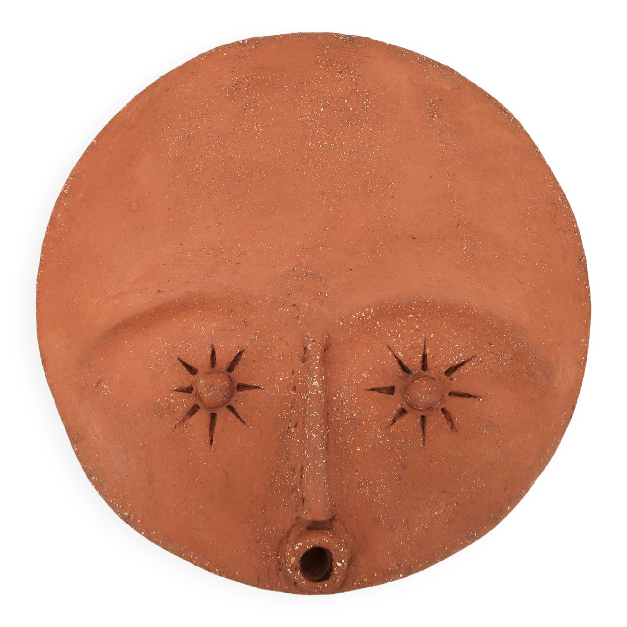 Round ceramic wall mask inspired by Africa, 1980s.