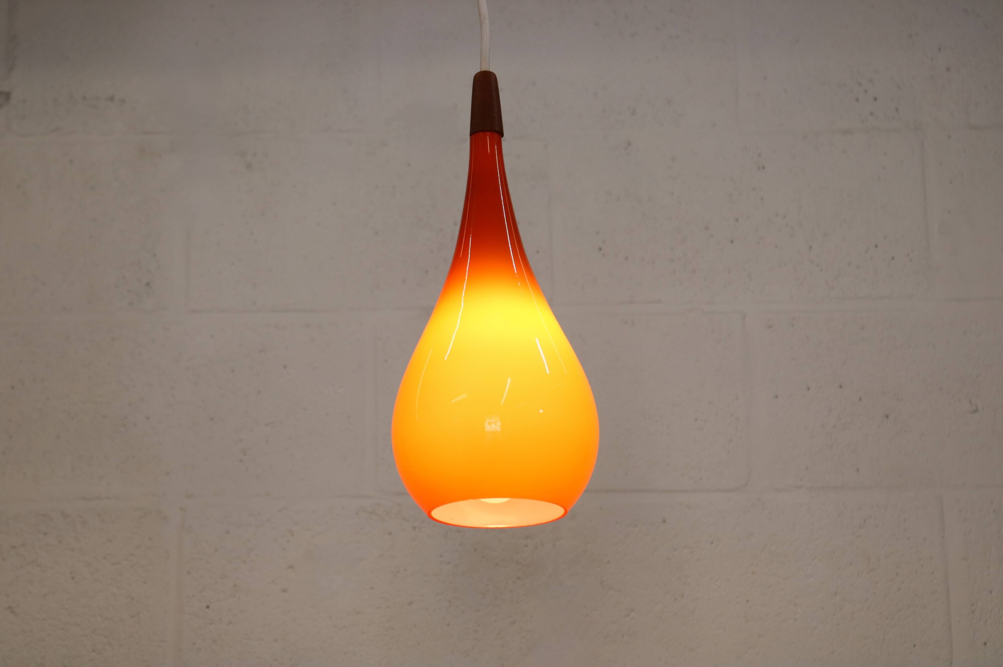 Orange teardrop glass pendant lamp made by Holmegaard - Denmark 1960
