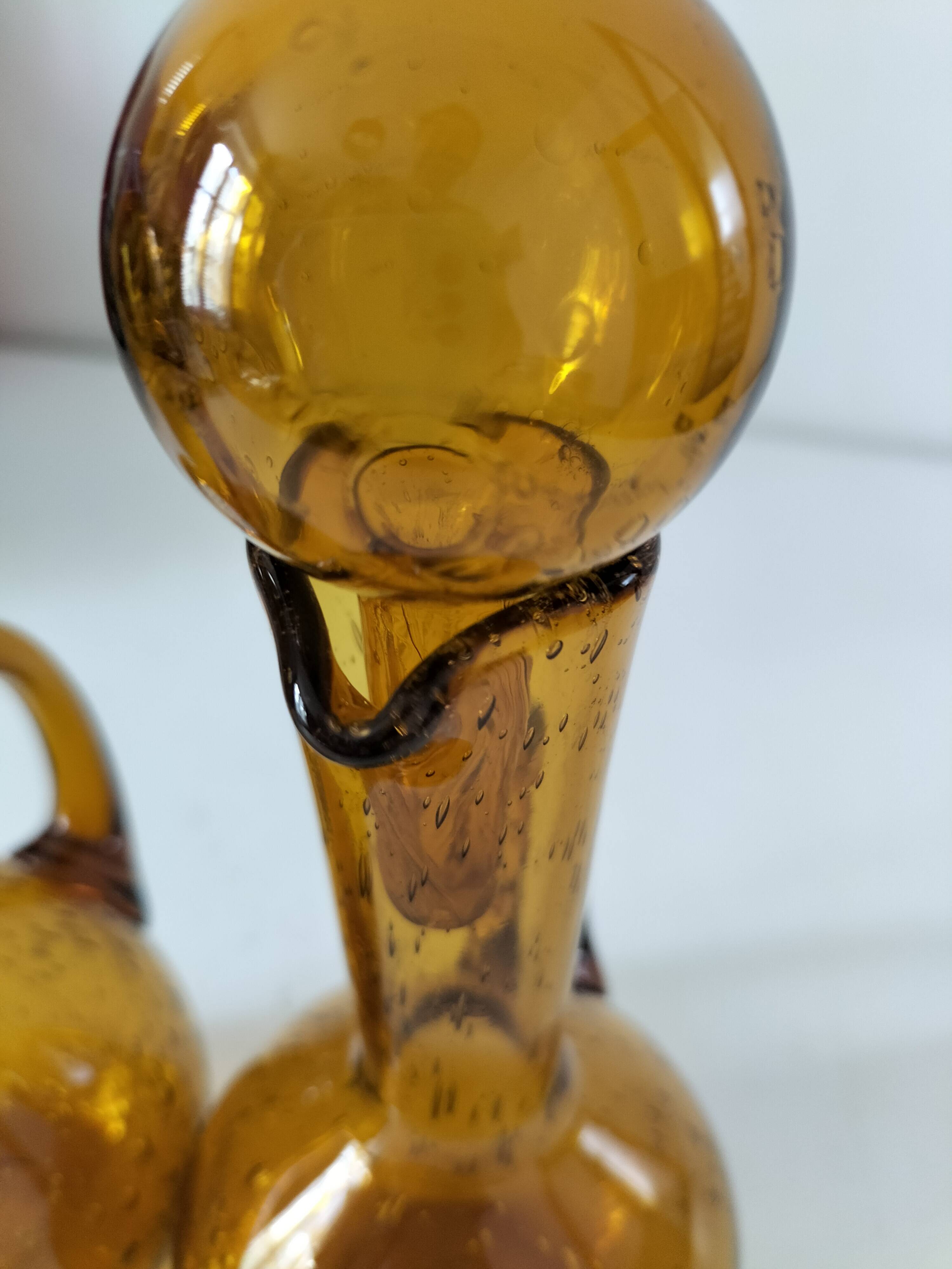 Duo of blown glass carafes – Biot signed – Bubbled amber glass