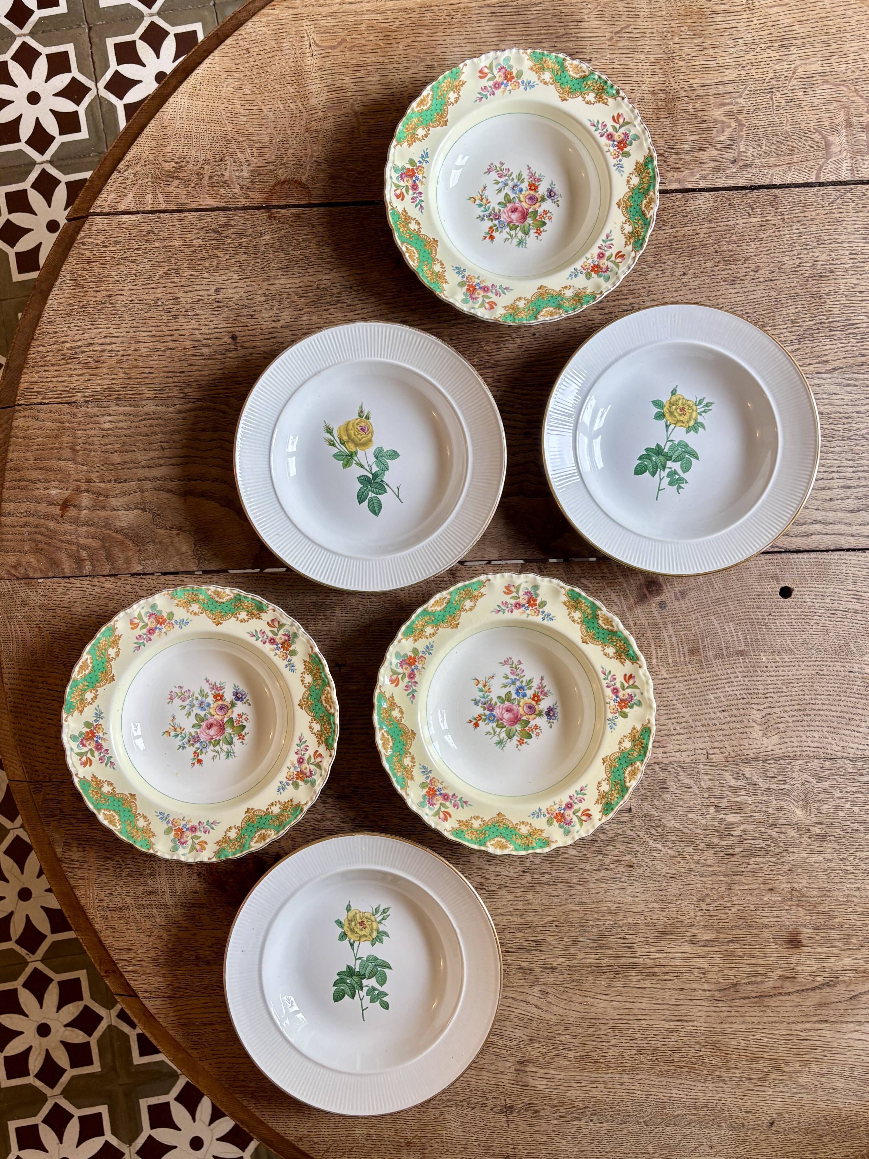Set of 6 mismatched antique deep plates.